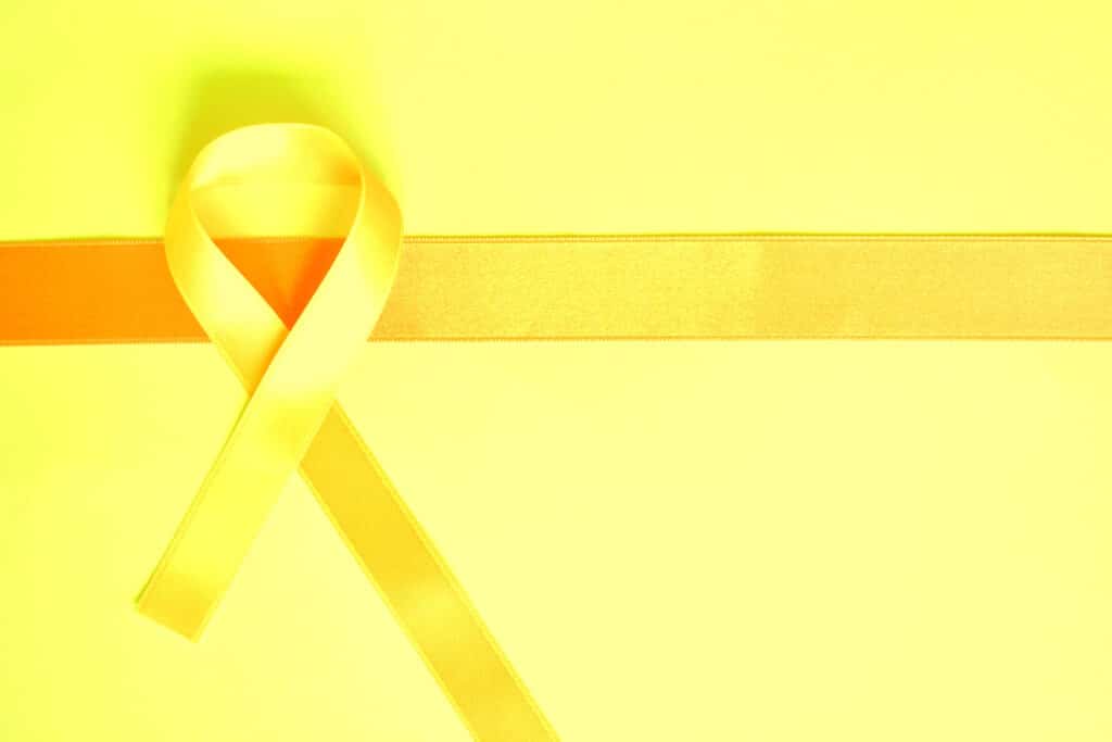 Fita amarela em forma de laço, representando a campanha Setembro Amarelo