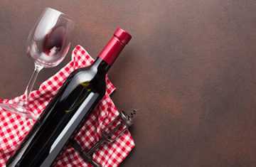 freepik vintage-background-with-red-bottle-of-wine