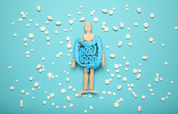 Boneco representando a microbiota intestinal com probióticos